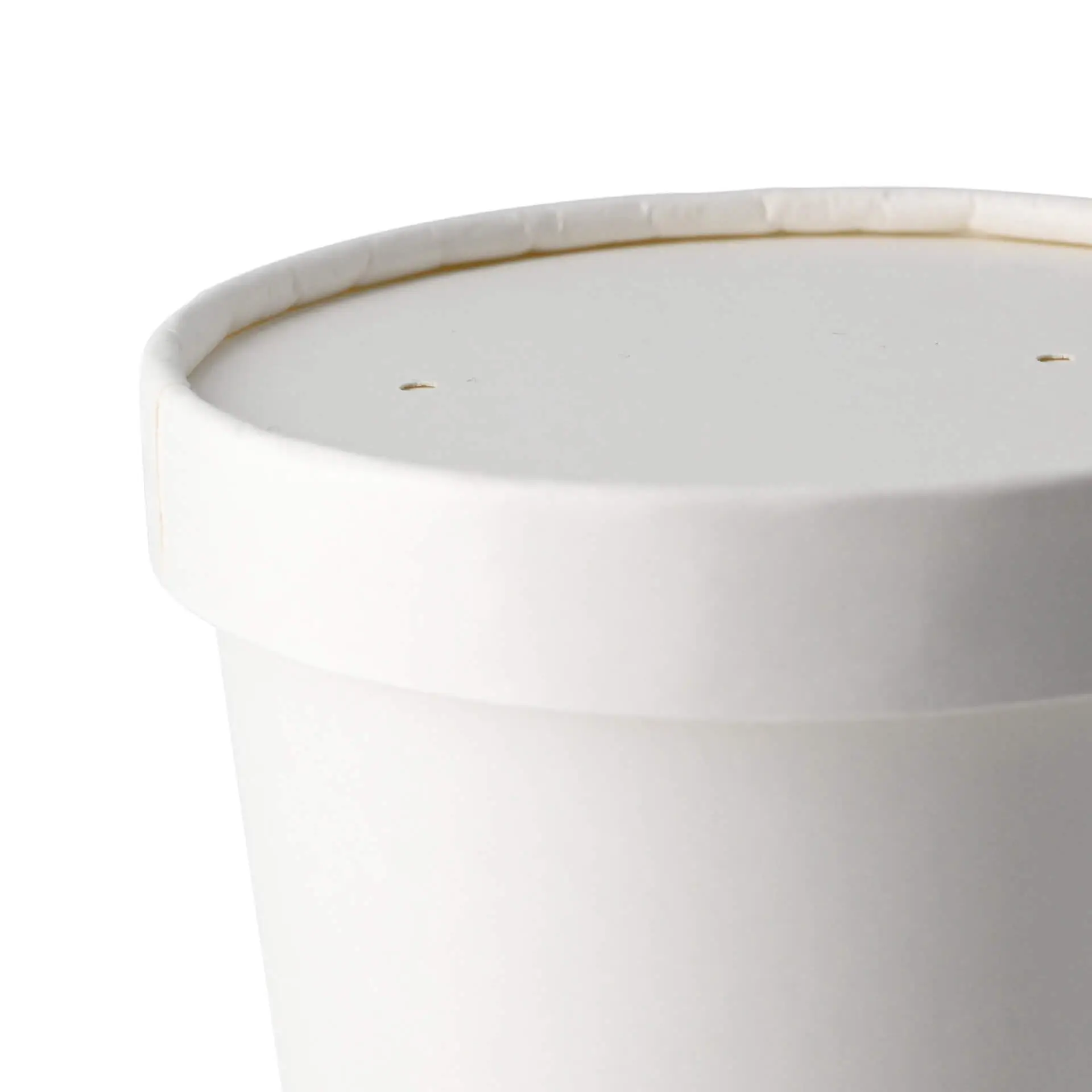 Coperchio in cartone bianco con un diametro di 100 mm e un'altezza di 17 mm, con due piccoli fori sopra.